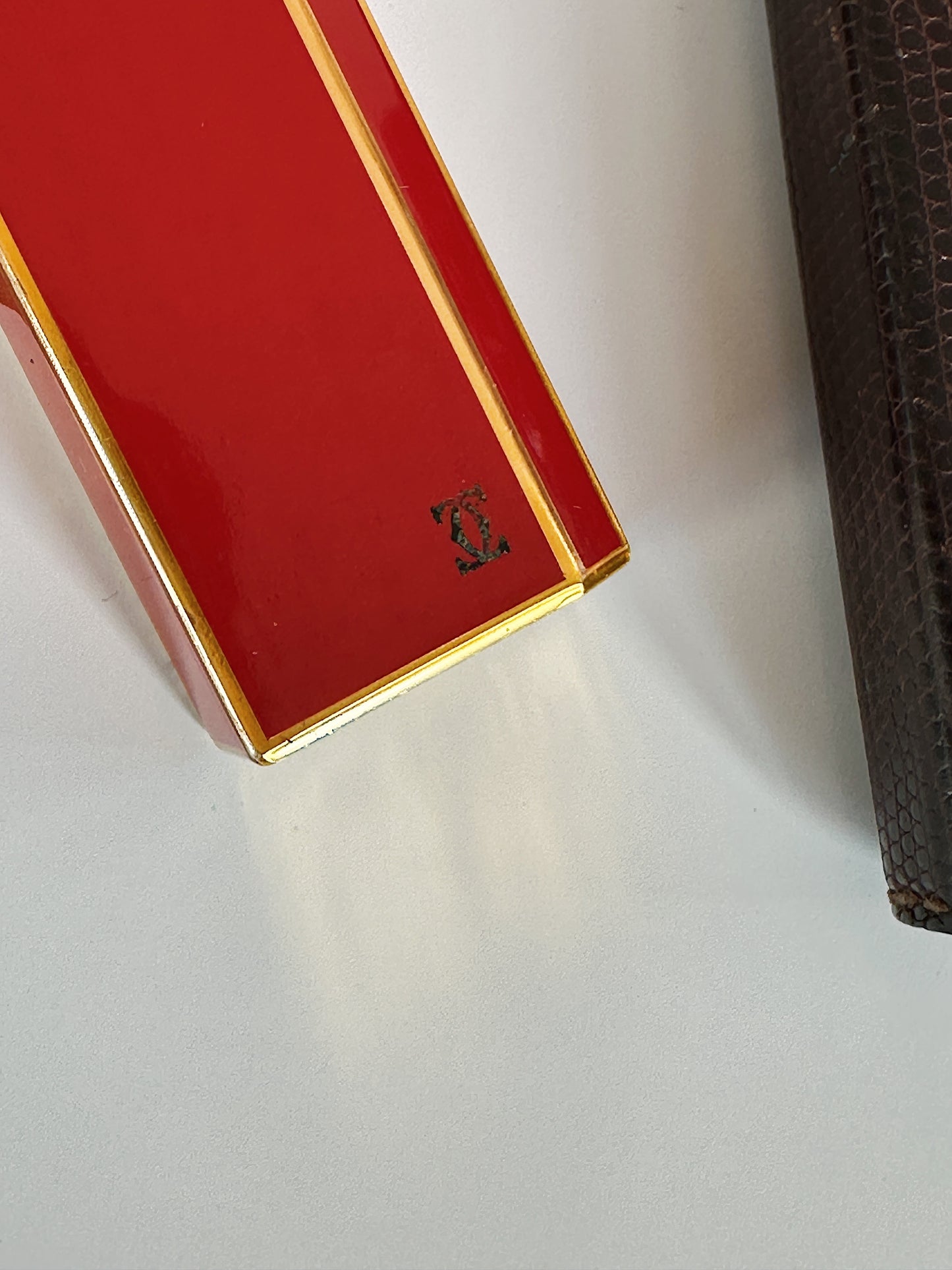 Vintage Cartier pentagon lighter, lacquered red-orange