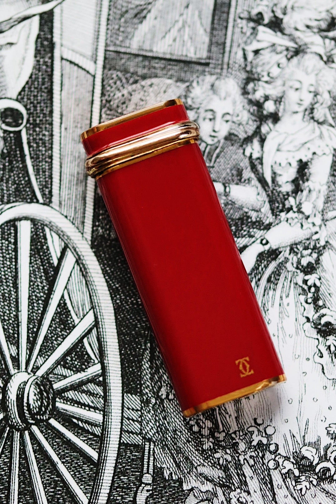 Cartier Trinity lighter, red lacquered with three gold accents