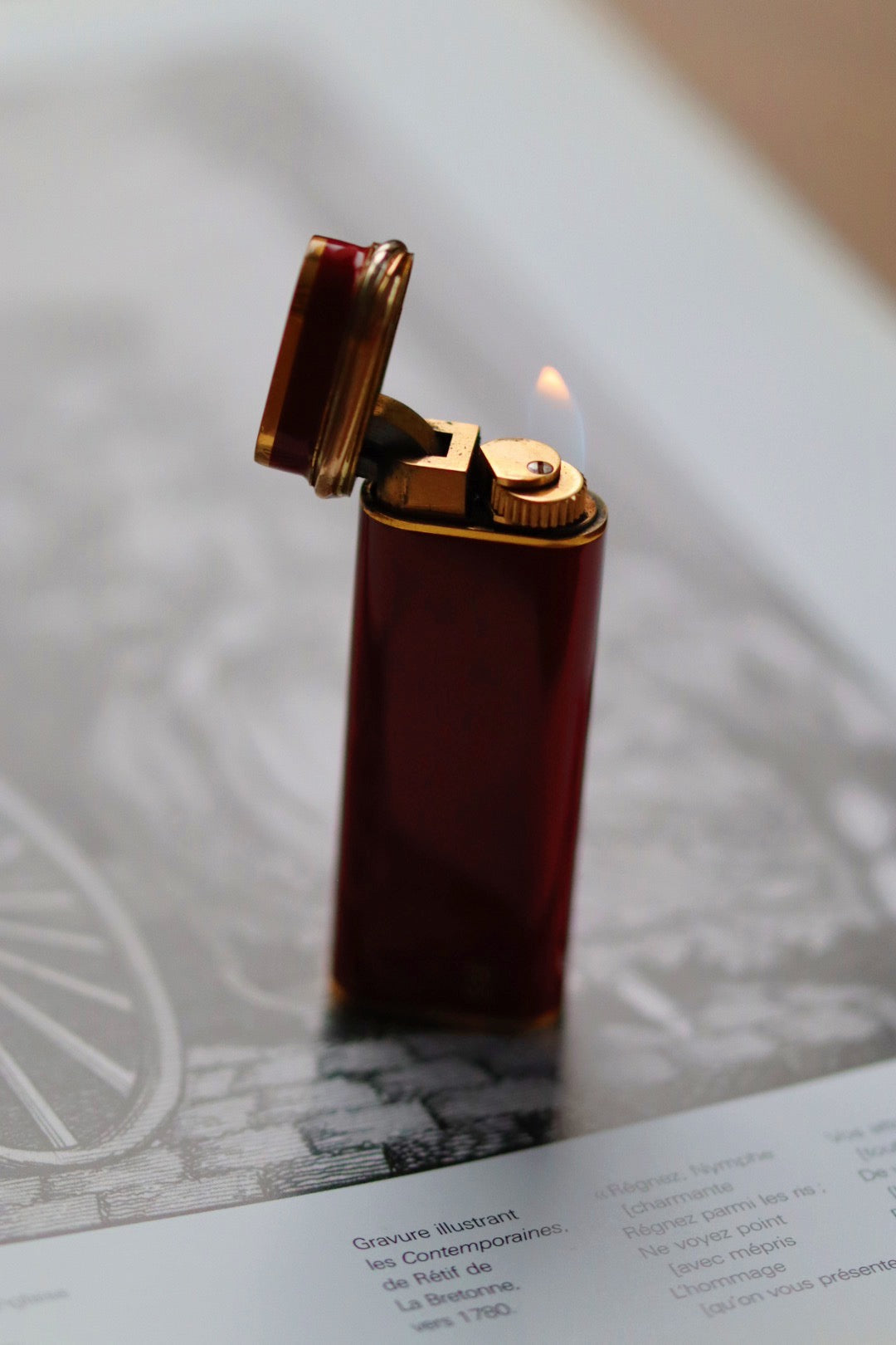 Cartier Trinity lighter, red lacquered with three gold accents