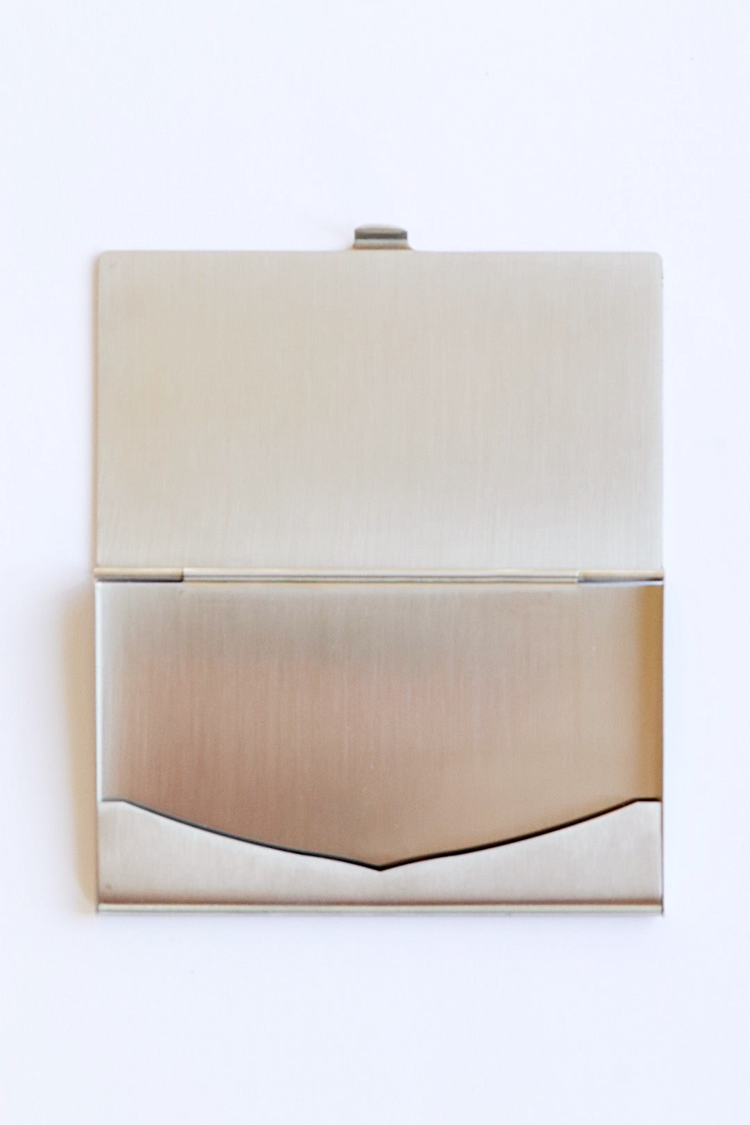 Cartier Santos card holder – Brushed steel and gold, an emblem of watchmaking elegance 