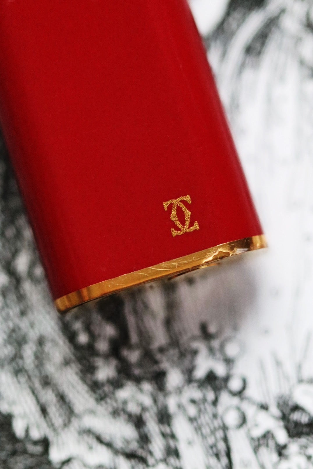 Cartier Trinity lighter, red lacquered with three gold accents