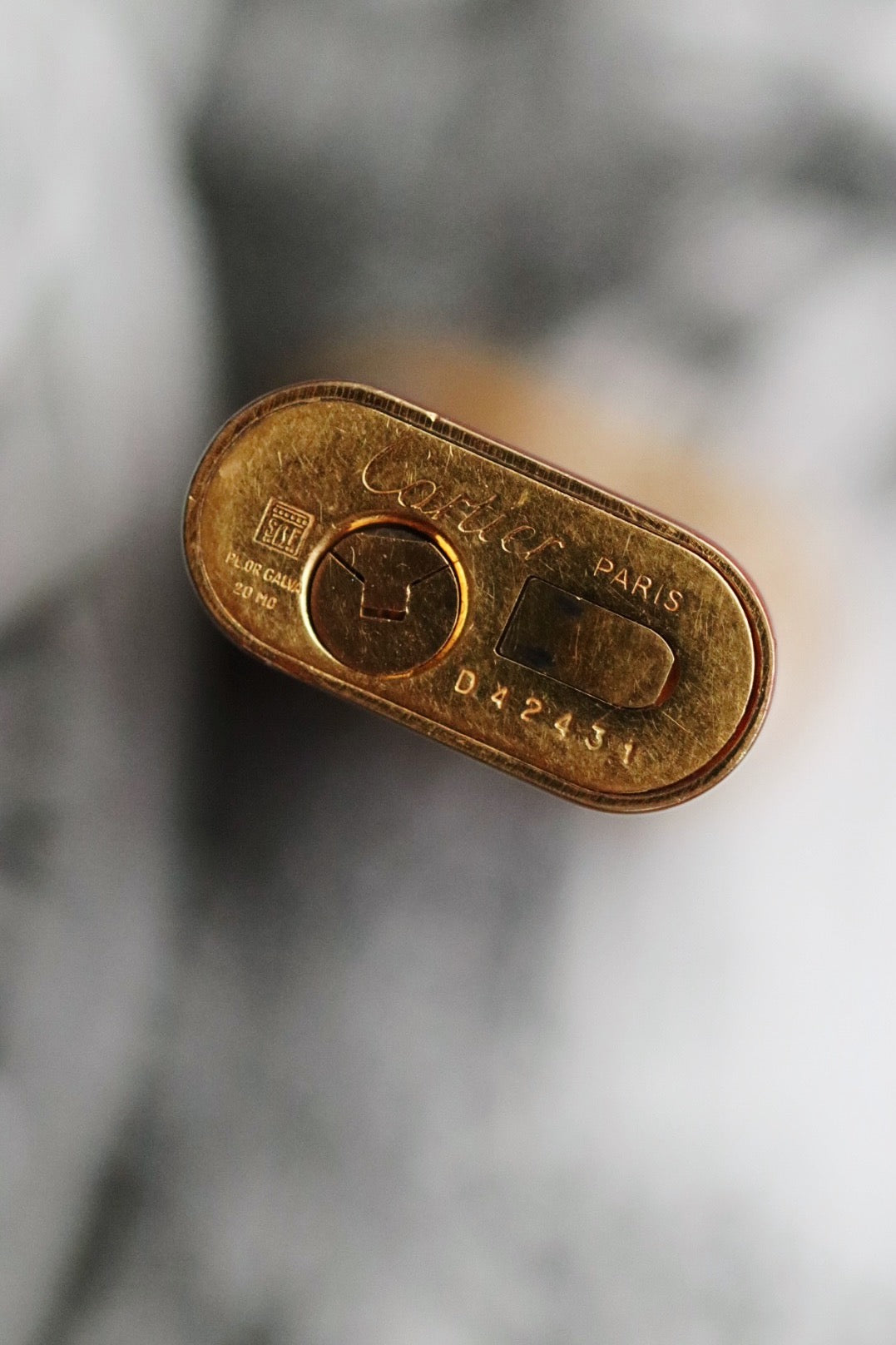 Cartier Trinity lighter, red lacquered with three gold accents