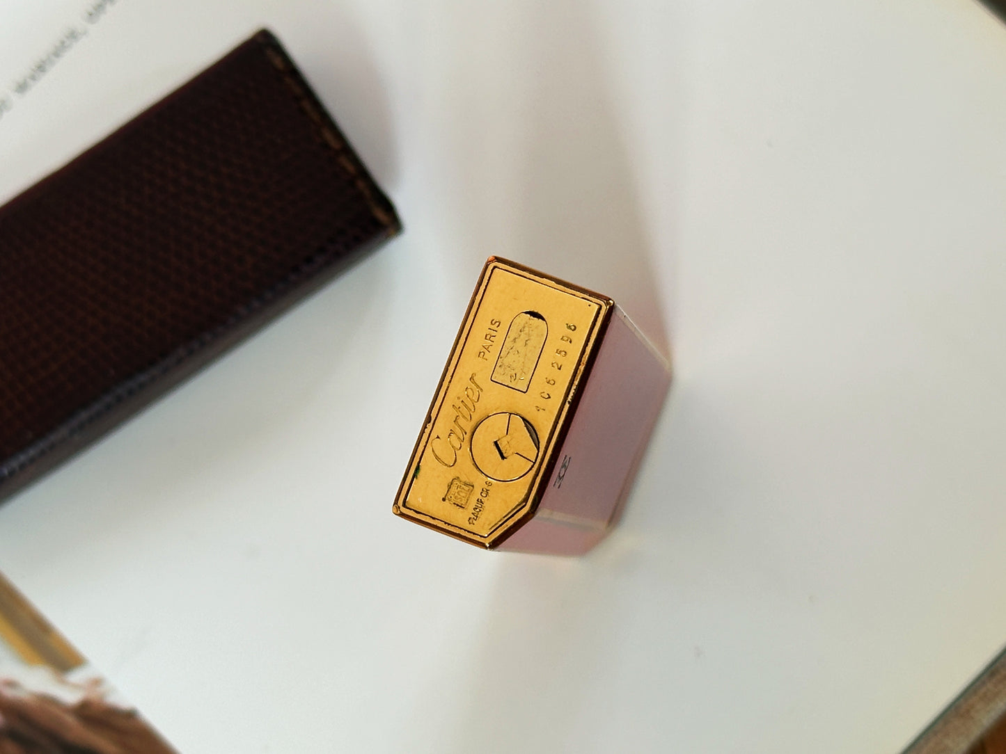 Vintage Cartier pentagon lighter, lacquered red-orange