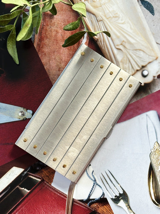 Cartier Santos card holder – Brushed steel and gold, an emblem of watchmaking elegance 